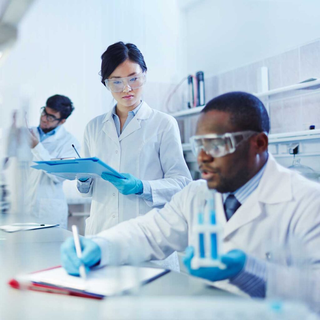 Scientists recording test results in a laboratory
